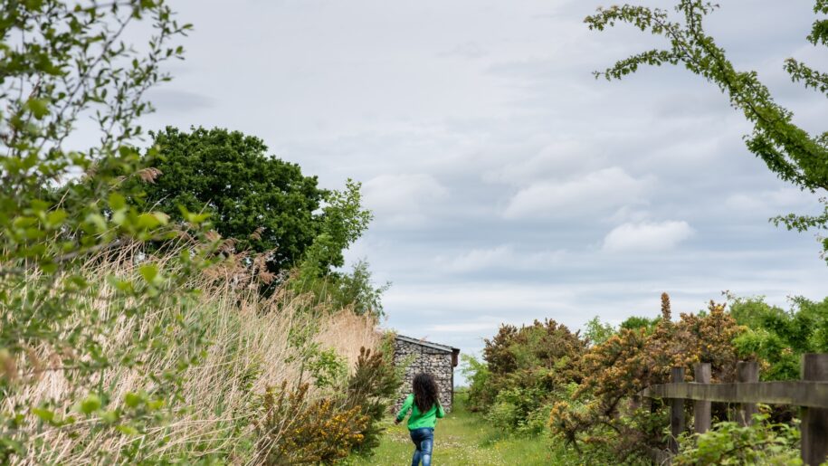 girl running in field