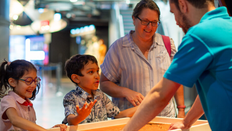 mum and boy looking and enjoying exhibition at the national space centre