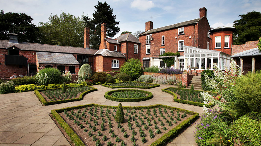 formal gardens and house