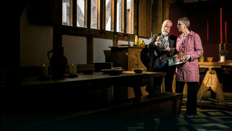 Couple studying artefacts at Barley Hall
