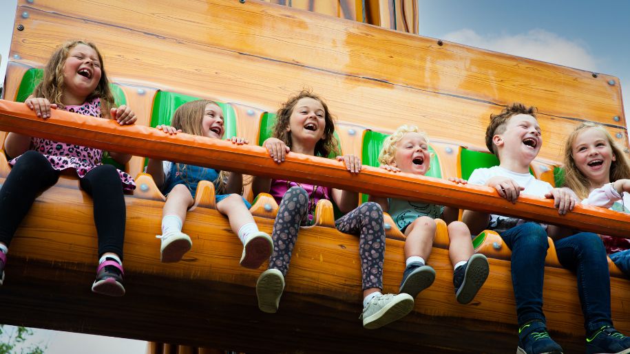 Children riding a drop-ride coaster at Camel Creek Adventure Park in Cornwall