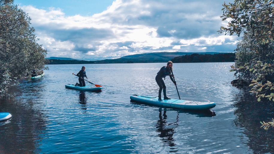 2 people paddle boarding at Corralea Activity Centre in Ireland
