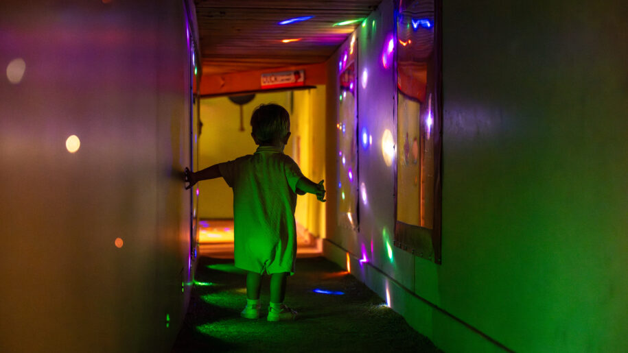 kid in light tunnel