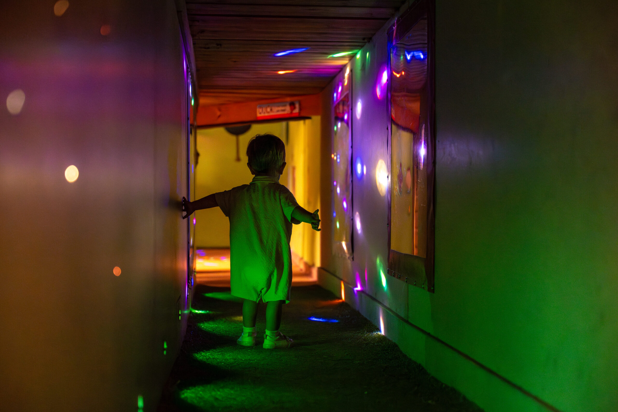 kid in light tunnel