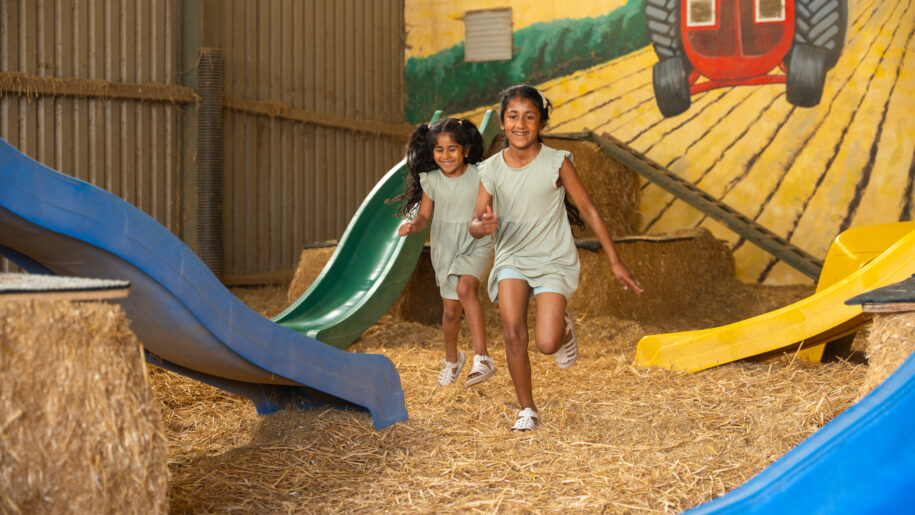 two girls running in playbarn