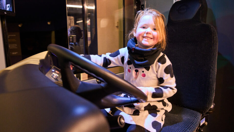 little girl drives bus