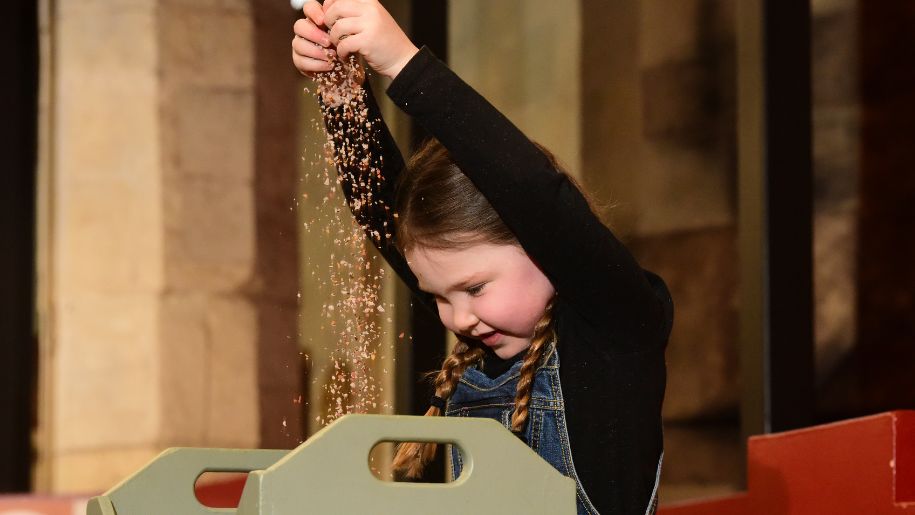 Girl playing with sand at Jorvik Dig