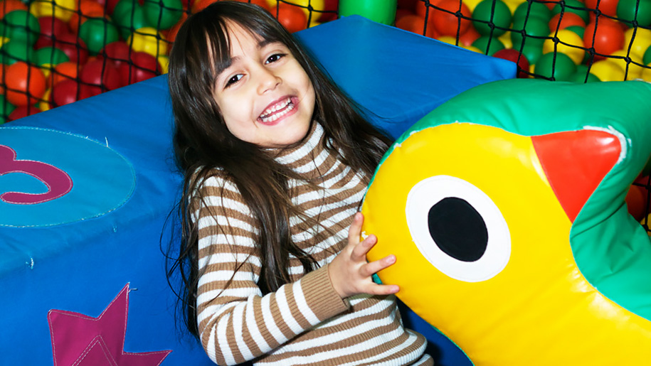 girl in soft play area