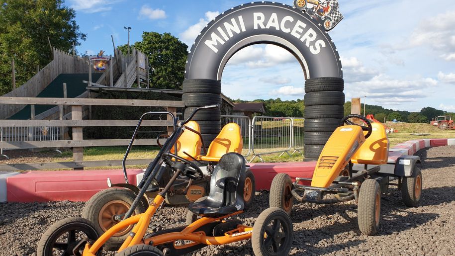 racetrack with a mini racer sign and quad bikes
