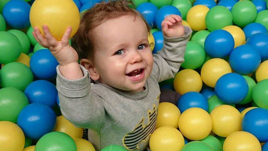 child in ball pool