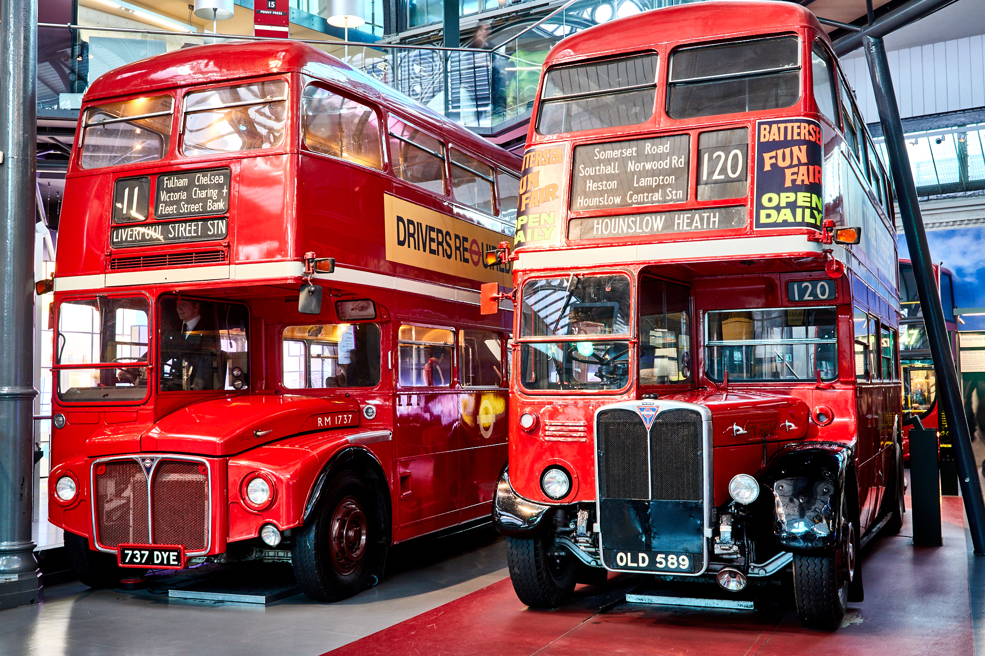 two red double decker buses