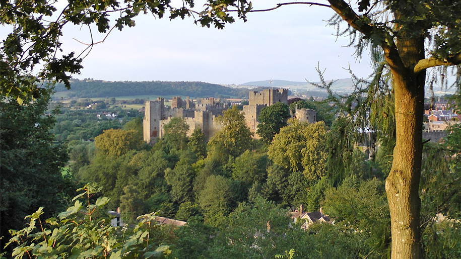 Ludlow Castle ruins viewed from a nearby hilltop in Shropshire.