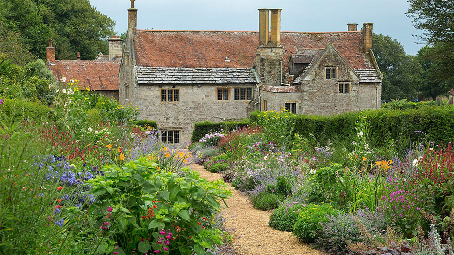 view of manor house through gardens