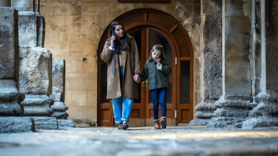 mother and child walk round roman baths