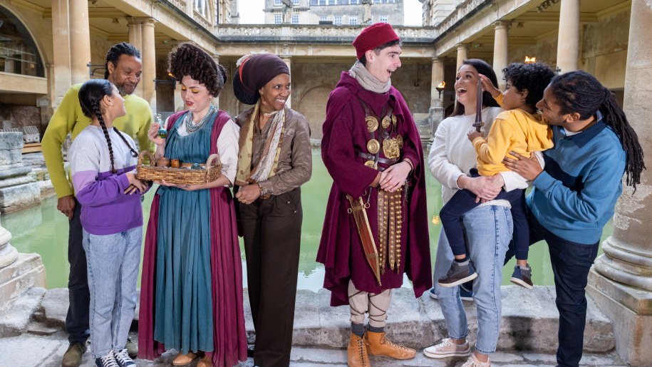 Costumed re-enactors and visitors at the Roman Baths.