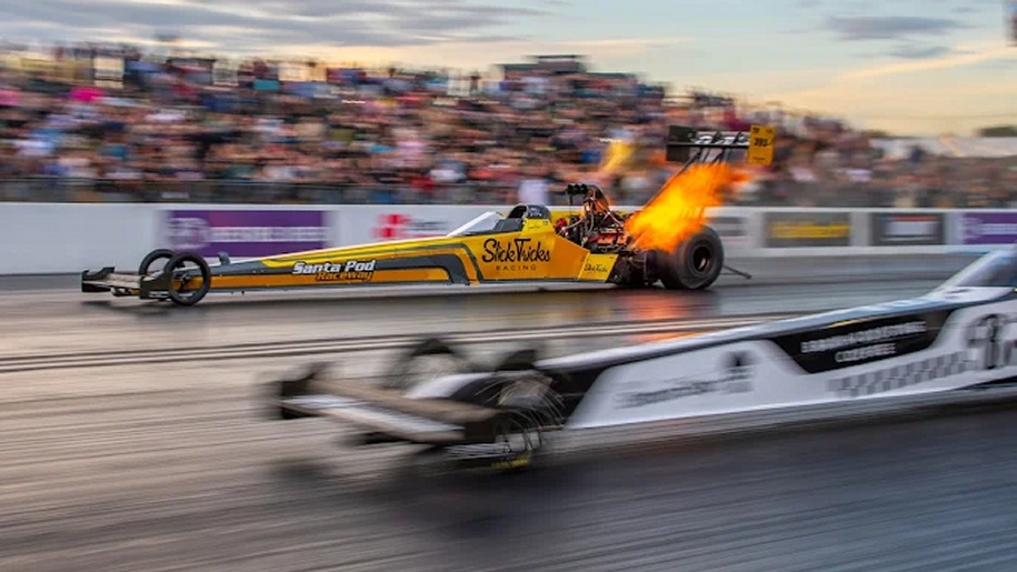Top Fuel dragsters racing at Santa Pod Raceway in Northamptonshire.