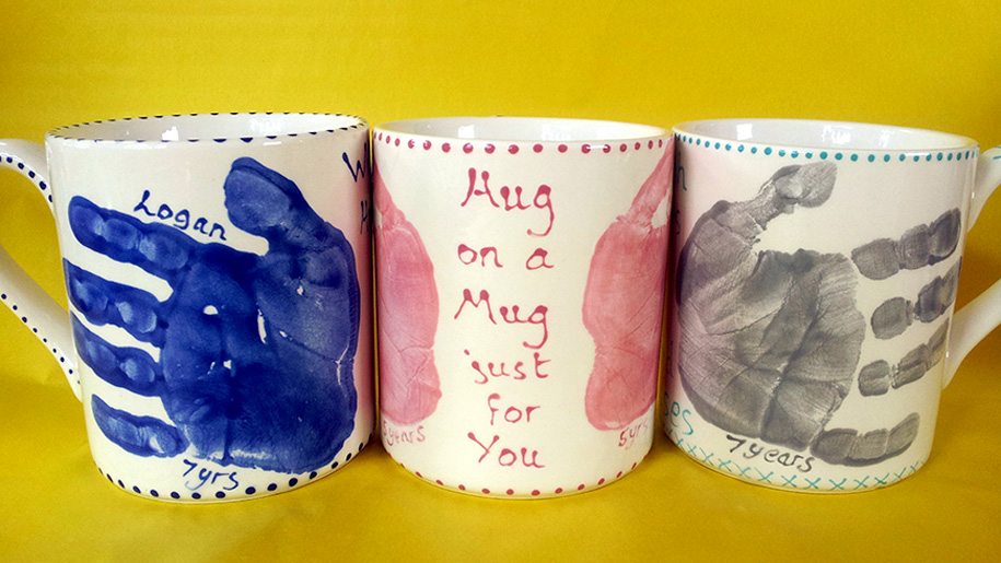 three painted mugs