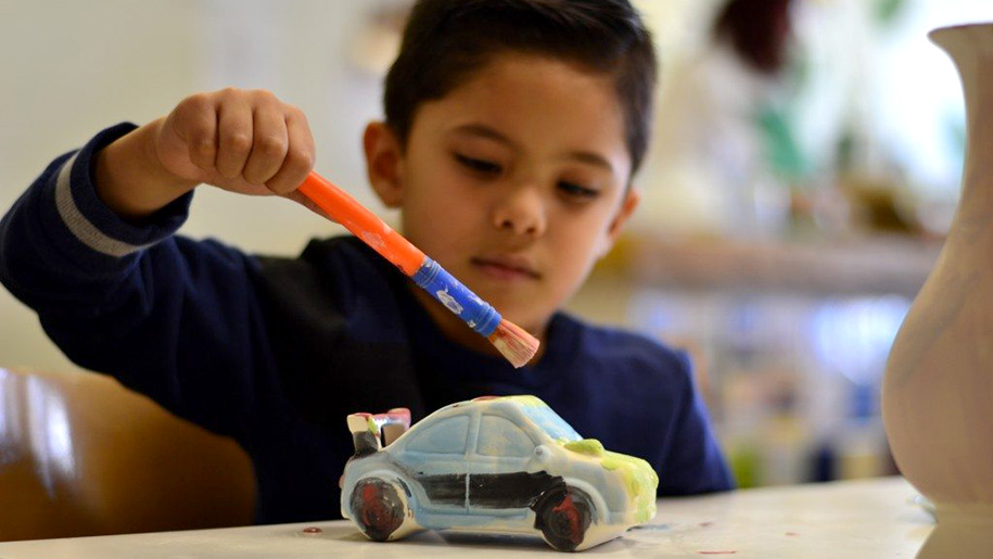 boy painting car