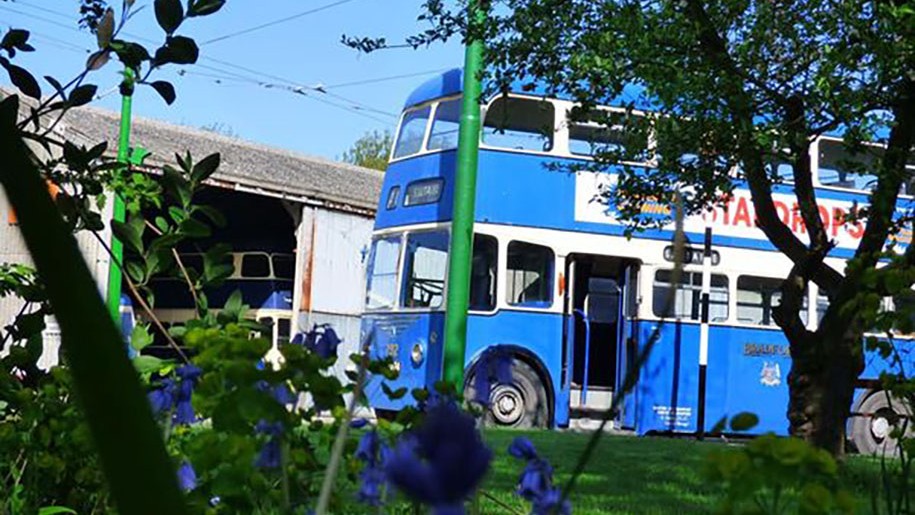 A blue double-decker trolleybus.