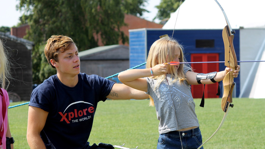 girl learning archery