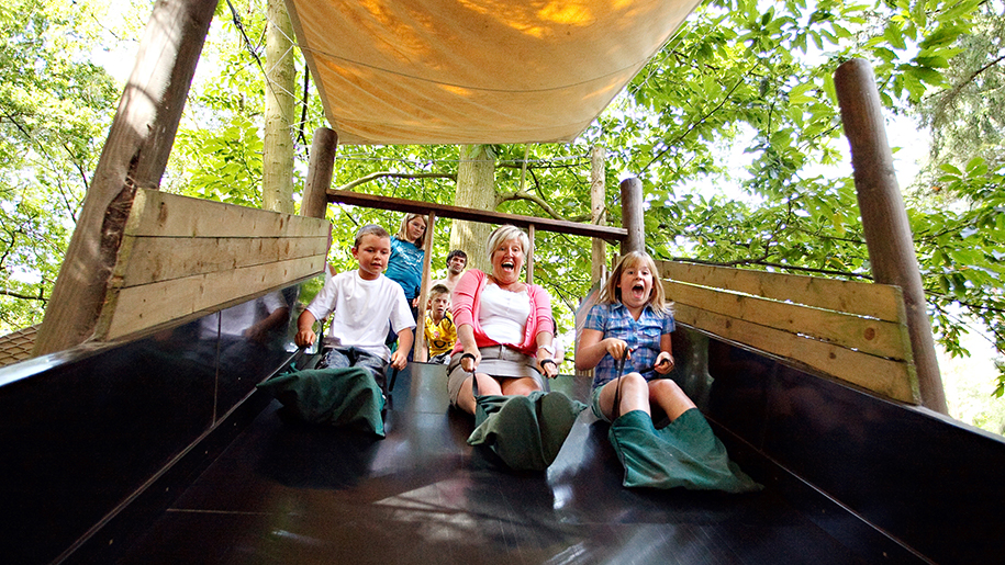 children laughing on slide