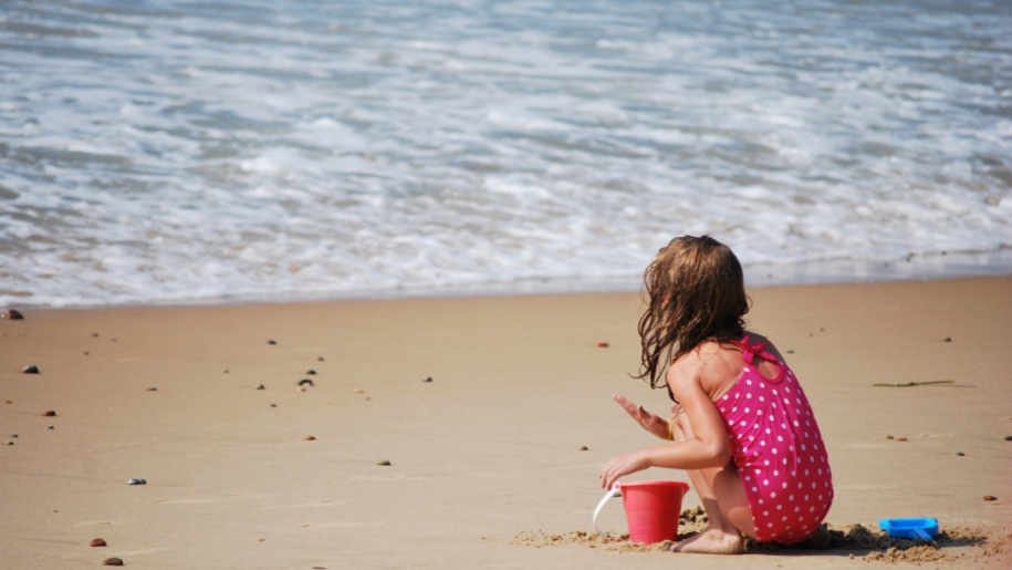 girl playing on beach