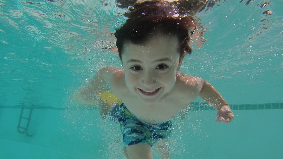 boy swimming underwater