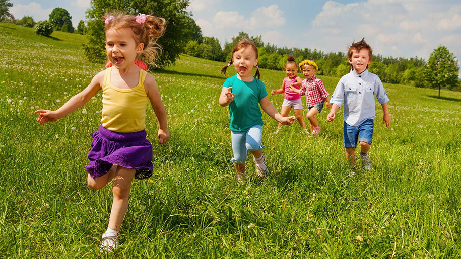 children running through fields