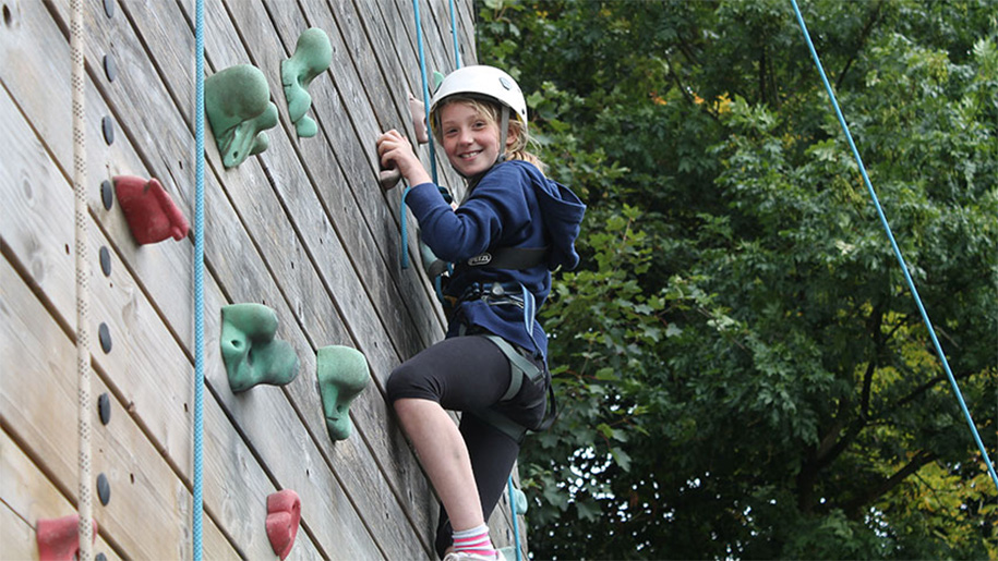 girl on rock climbing wall