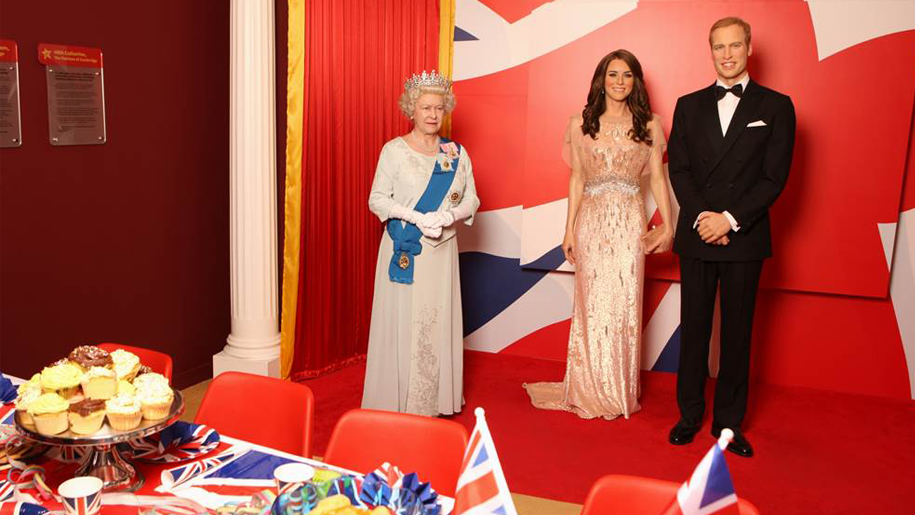 wax figures of the queen, prince william and kate