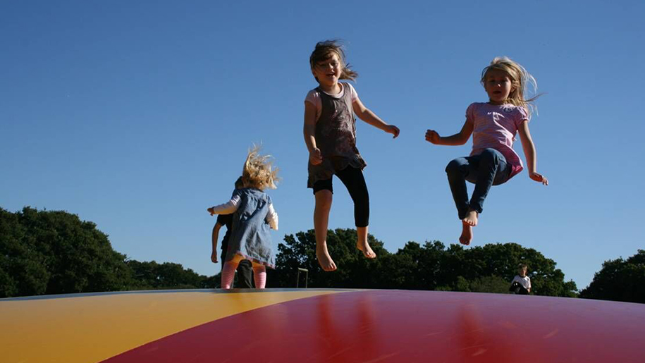 children jumping on bouncing castle