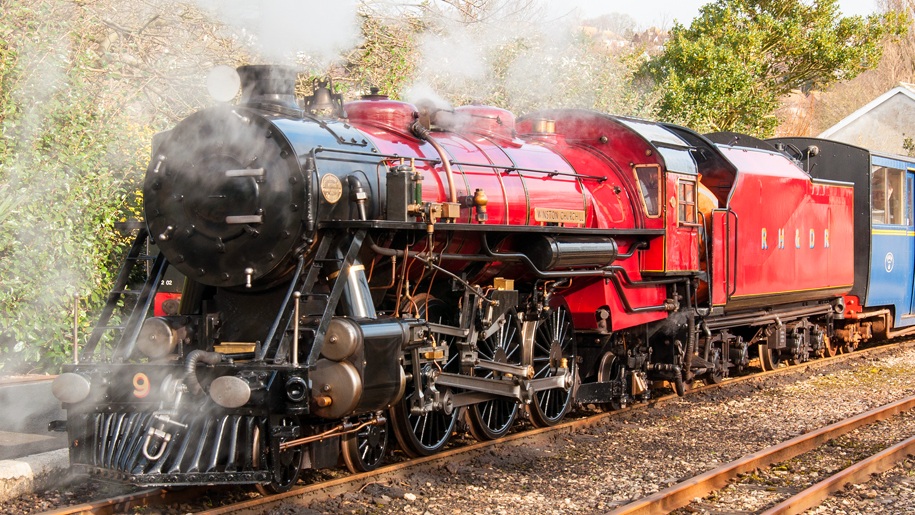 Romney, Hythe, Dymchurch railway red steam train