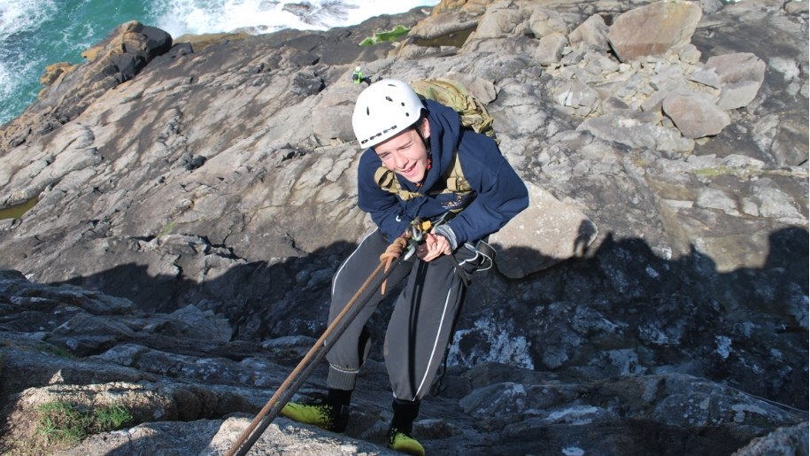 abseiling on cliff
