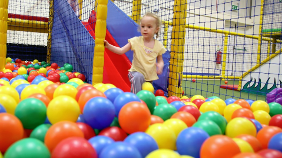 child in ball pit