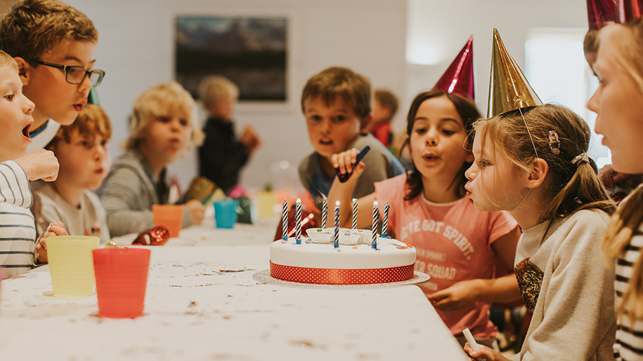 kids with birthday cake