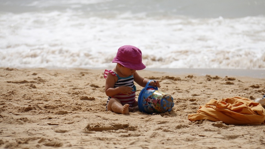girl playing with sand