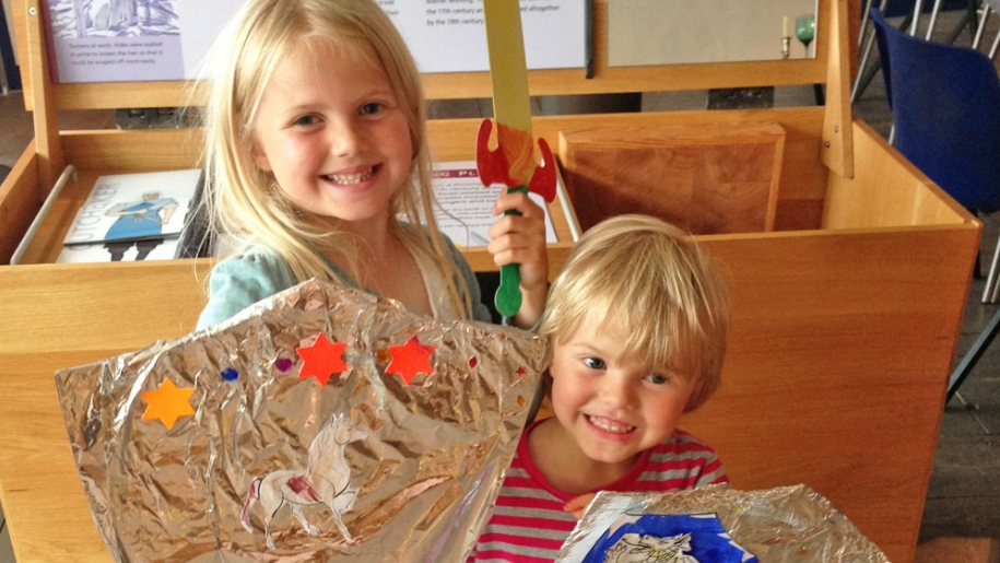 kids with handmade shields