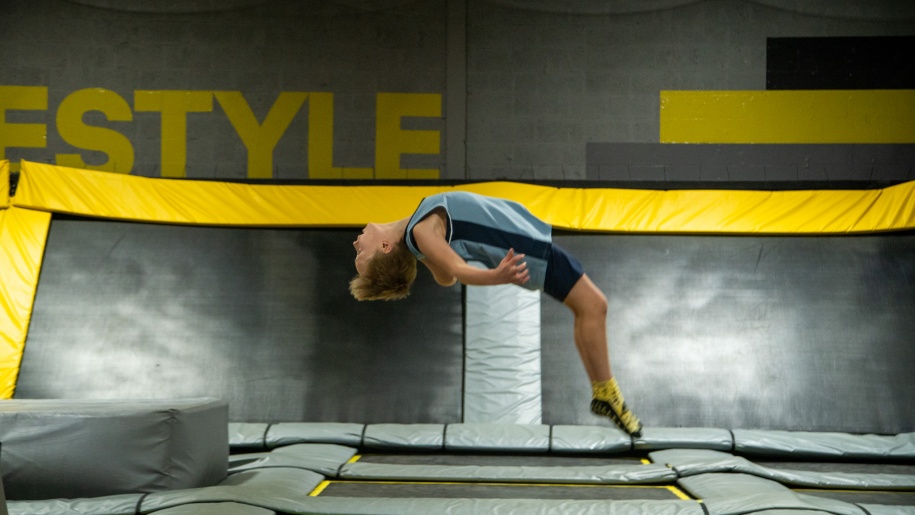 Child doing a back flip at AirHop Trampoline Park Cheshire Oaks.