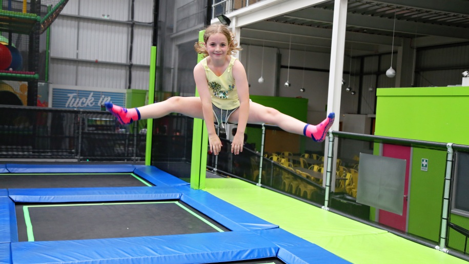Child bouncing on trampolines.