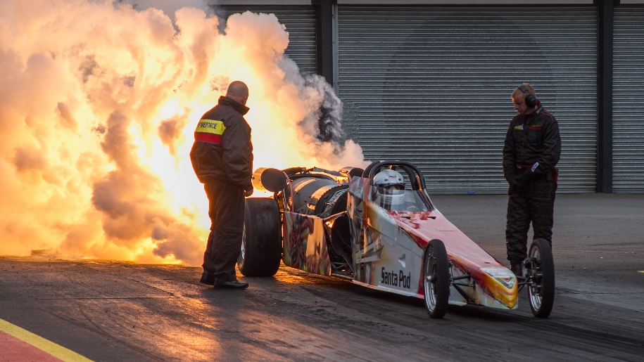 Santa Pod Raceway car with flames