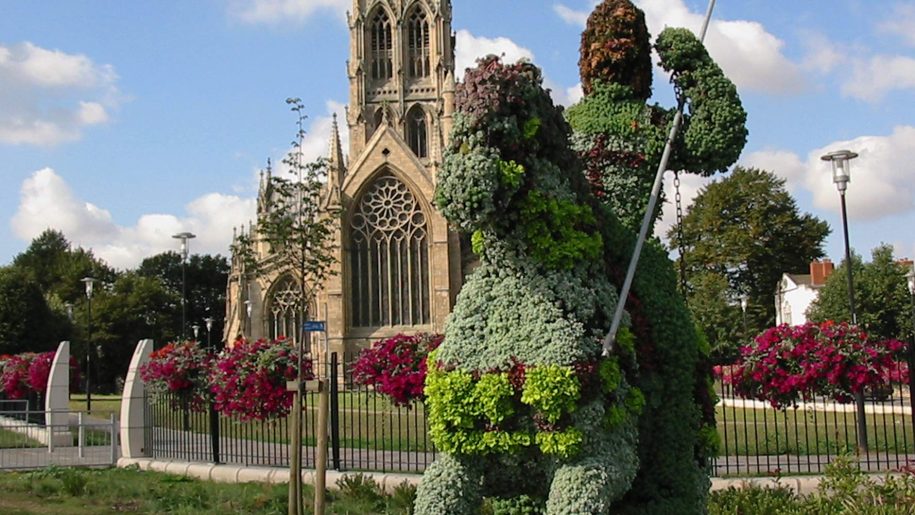 hedge figure in front of church