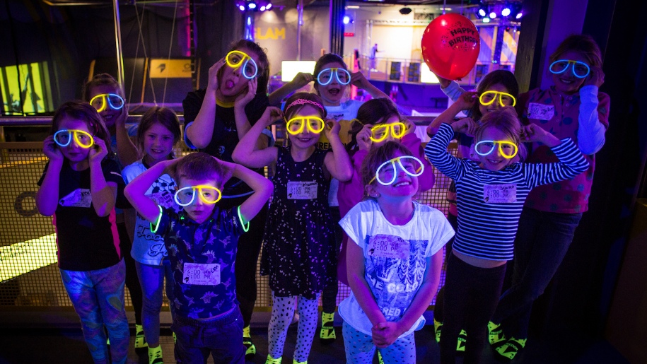 children in glow in the dark glasses and socks