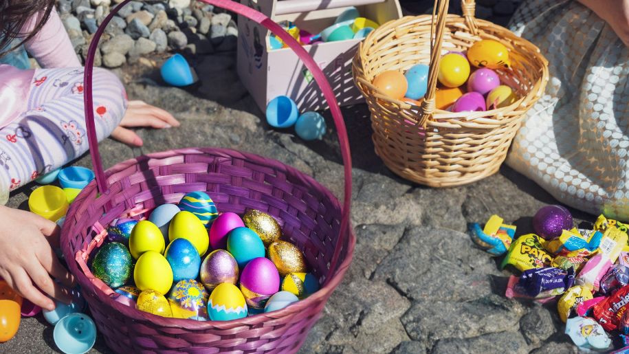 girl holding basket with easter eggs in