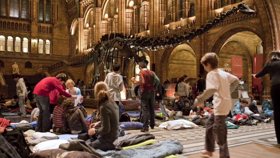 children in museum with sleeping bags