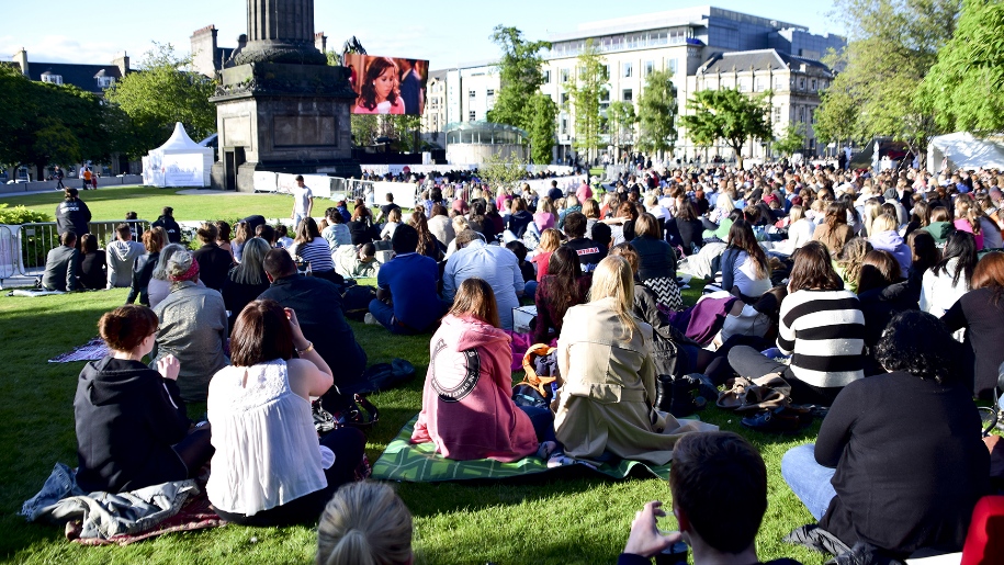 crowd of people watching outdoor cinema