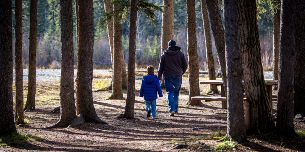 dad and son walking together