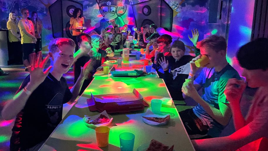 Children sat around a table at the UV party room at Jump In Aberdeen