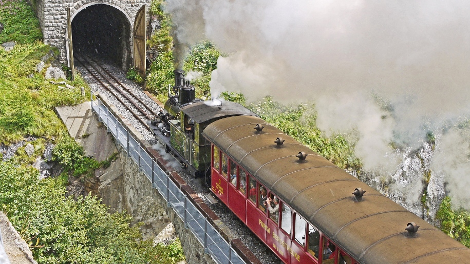 steam train going into tunnel