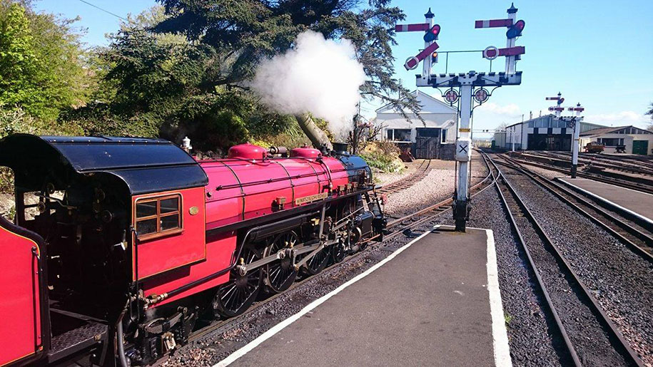 steam train arriving at station