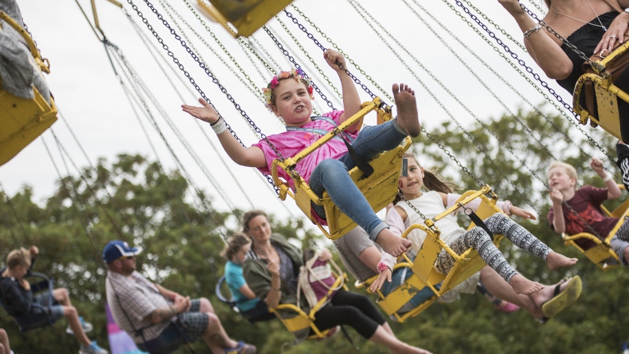 girl on fair ground swing